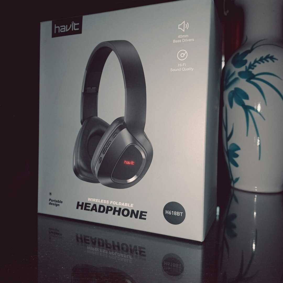 Professional over-ear studio headphones on a wooden desk